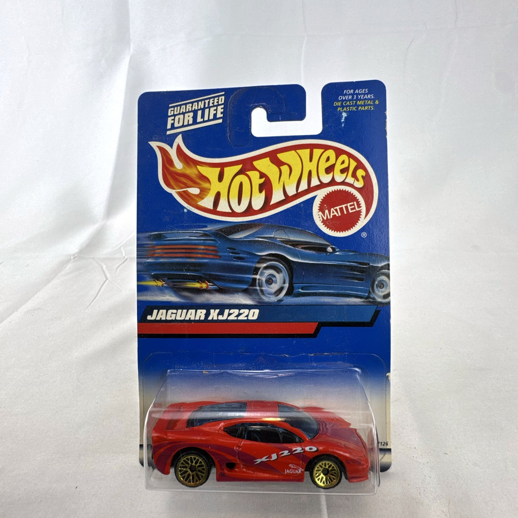 Hot Wheels 2000 Mainline 1:64 scale red Jaguar XJ220 diecast car in original blister packaging