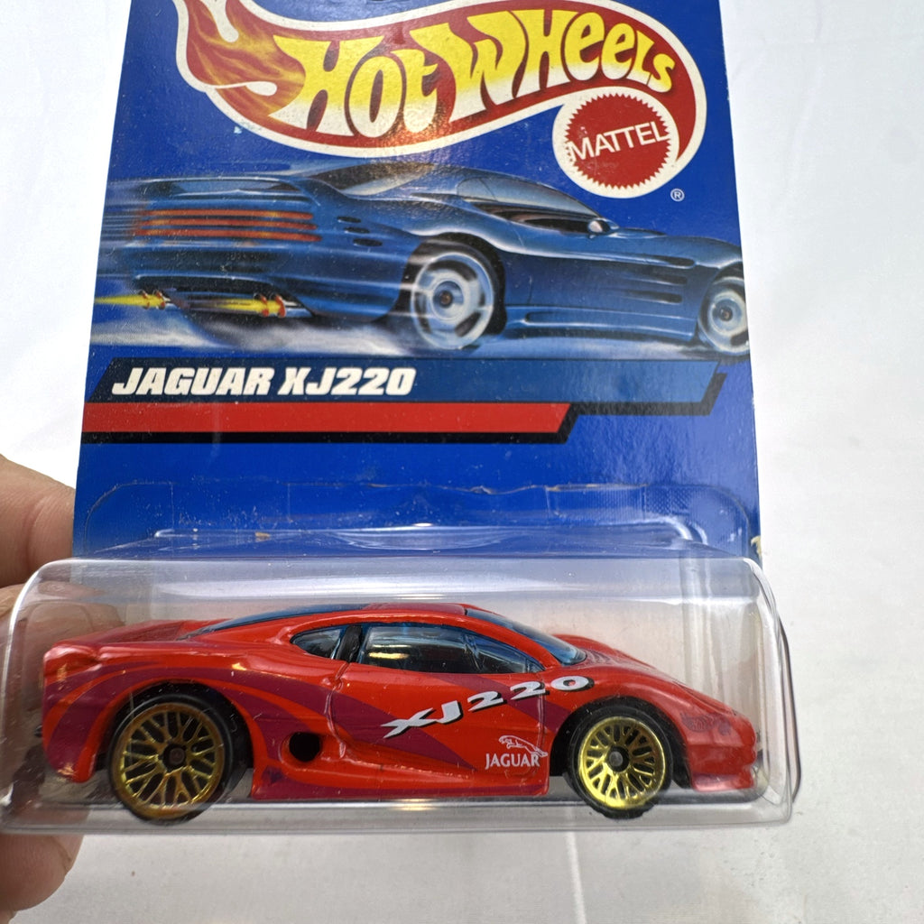 Hot Wheels 2000 Mainline 1:64 scale red Jaguar XJ220 diecast car in original blister packaging