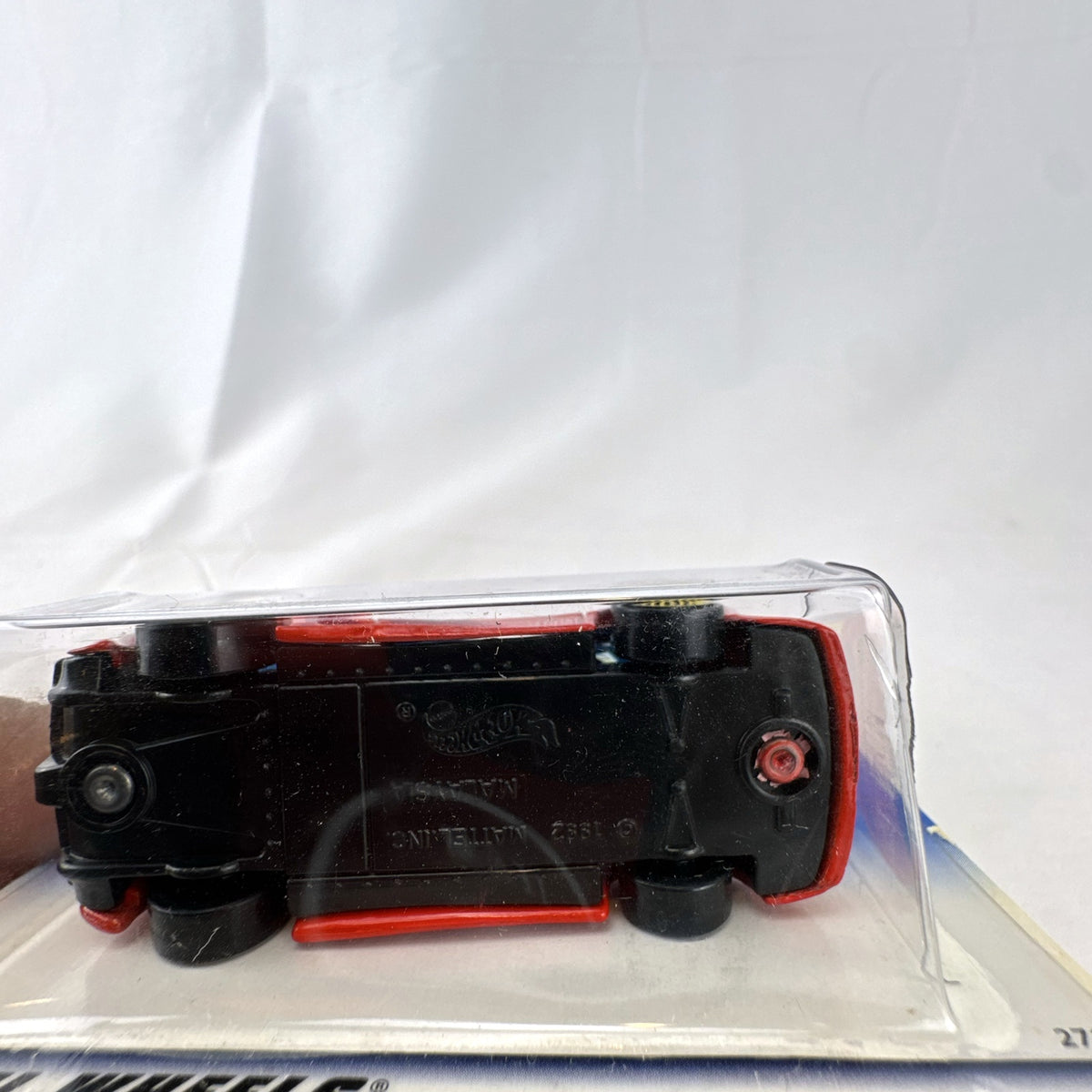 Hot Wheels 2000 Mainline 1:64 scale red Jaguar XJ220 diecast car in original blister packaging