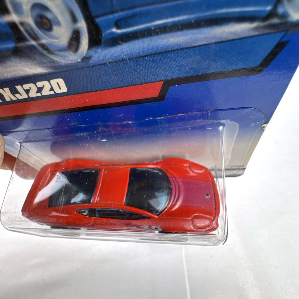 Hot Wheels 2000 Mainline 1:64 scale red Jaguar XJ220 diecast car in original blister packaging