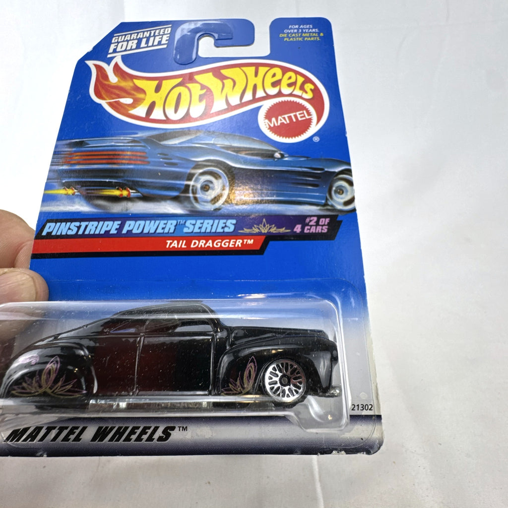 Hot Wheels Tail Dragger 1:64 scale diecast car in gloss black on original Pinstripe Power blister card