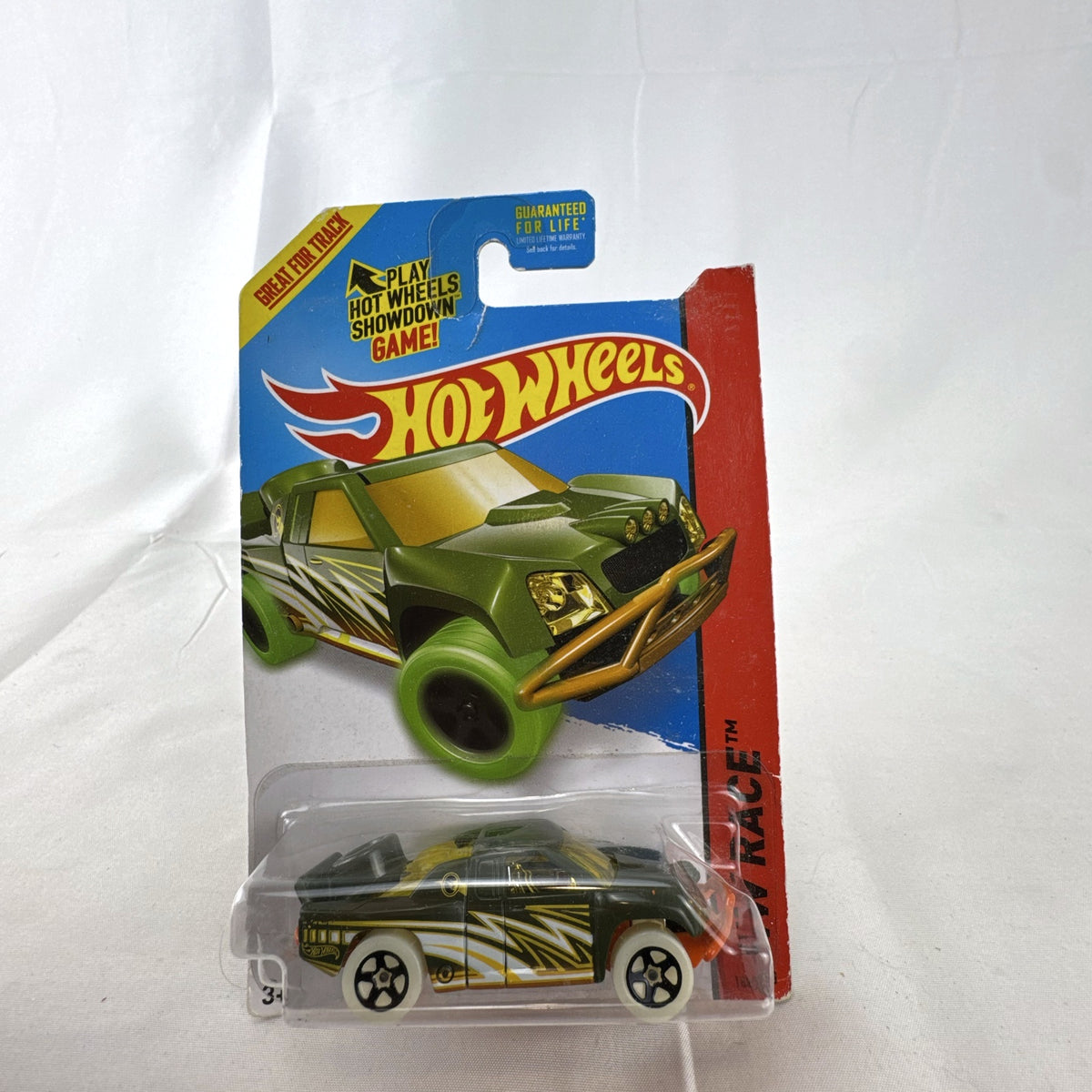 Hot Wheels 2014 Off Track Treasure Hunt 1:64 diecast truck sealed in original card packaging.