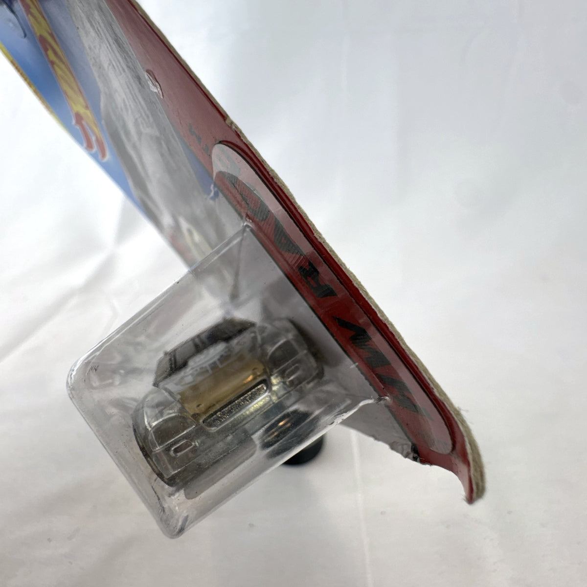 Hot Wheels Stockar 1:64 scale diecast car with clear body and gold chrome wheels in original unopened packaging