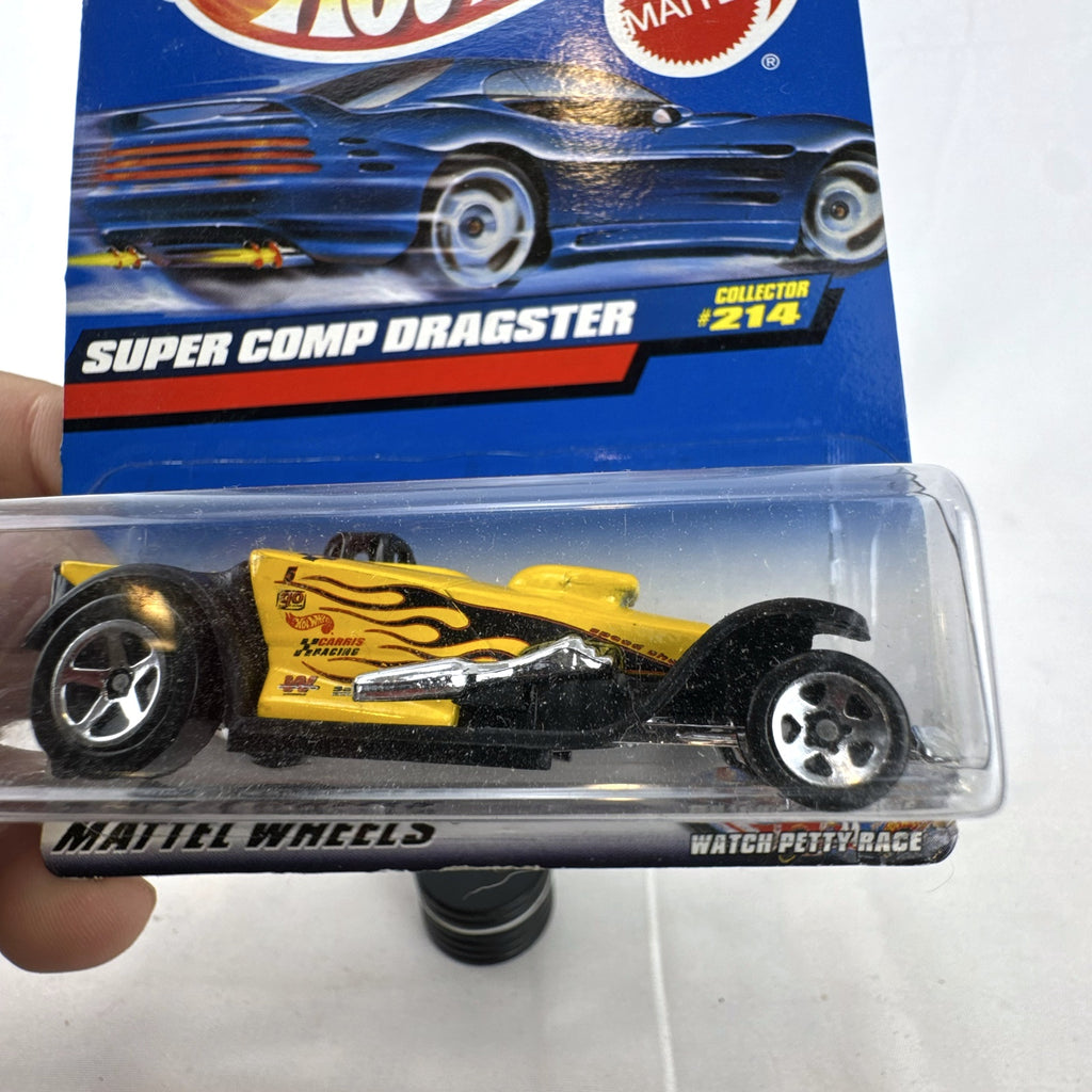 Hot Wheels 2000 Super Comp Dragster 1:64 scale diecast car in yellow with black flames sealed on card