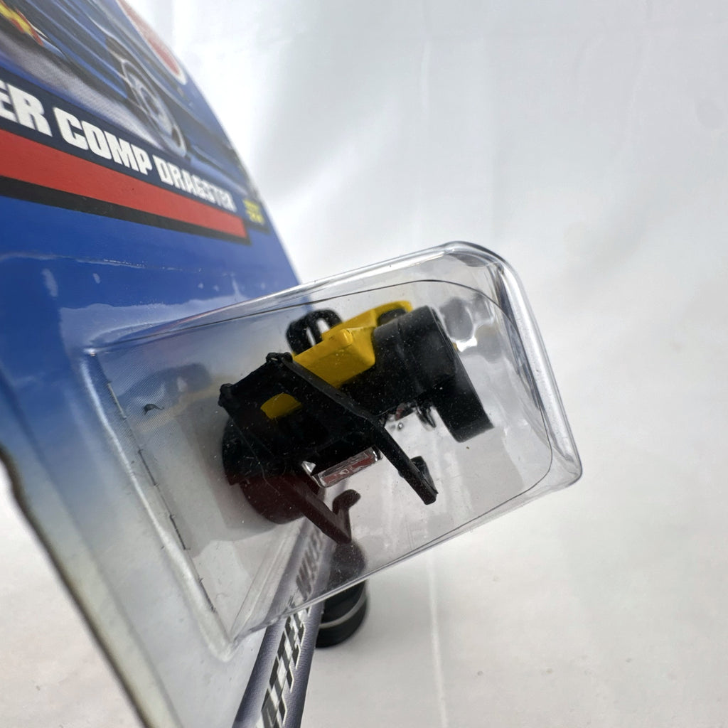 Hot Wheels 2000 Super Comp Dragster 1:64 scale diecast car in yellow with black flames sealed on card