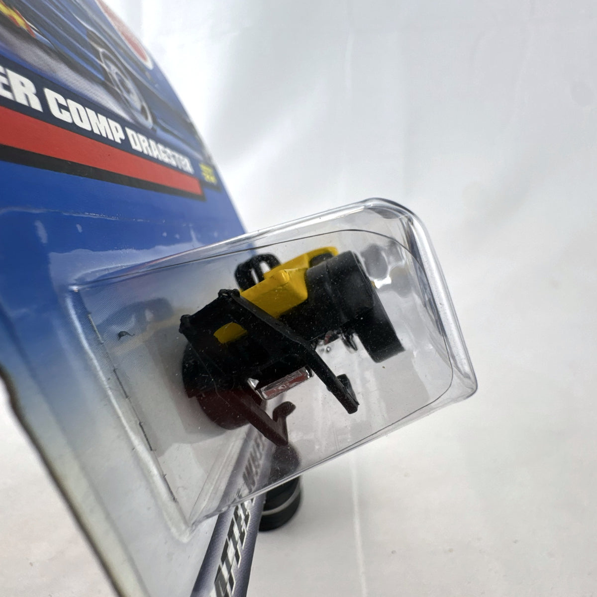 Hot Wheels 2000 Super Comp Dragster 1:64 scale diecast car in yellow with black flames on original blister card