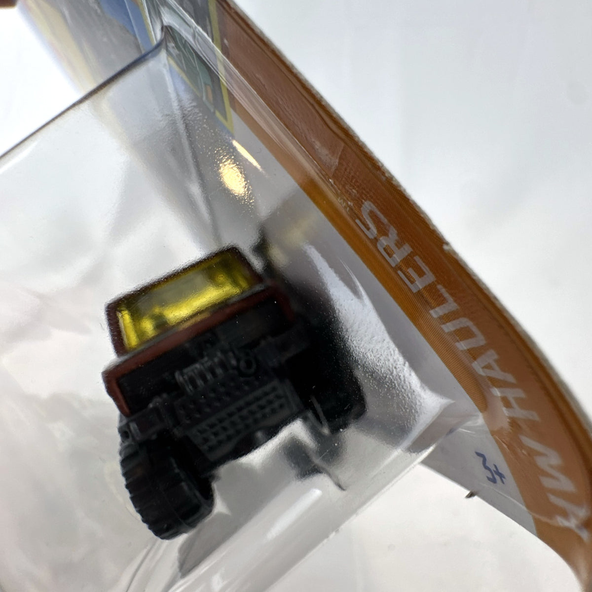 Hot Wheels 1:64 scale Mercedes-Benz Unimog 1300 diecast rescue truck in brown, sealed on card