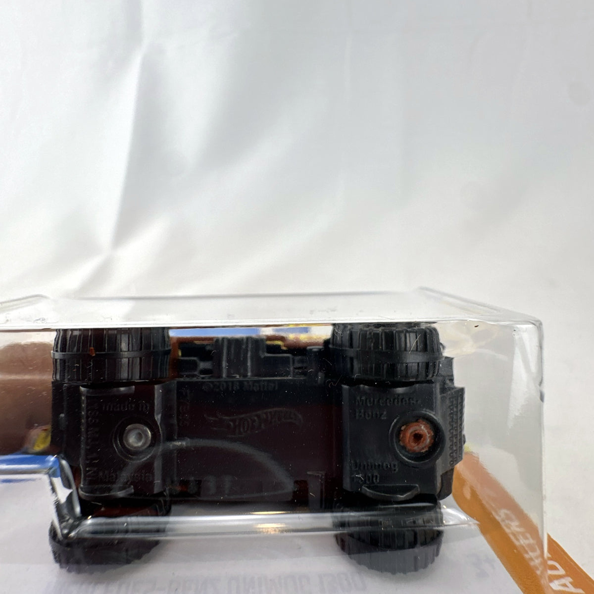 Hot Wheels 1:64 scale Mercedes-Benz Unimog 1300 diecast rescue truck in brown, sealed on card