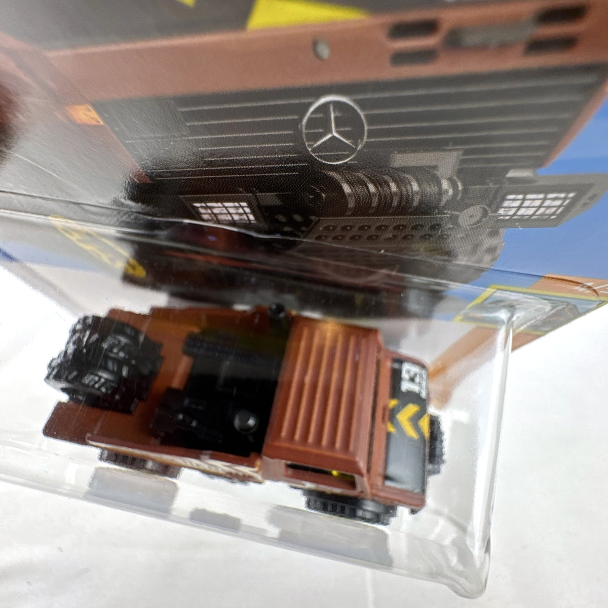 Hot Wheels 1:64 scale Mercedes-Benz Unimog 1300 diecast rescue truck in brown, sealed on card