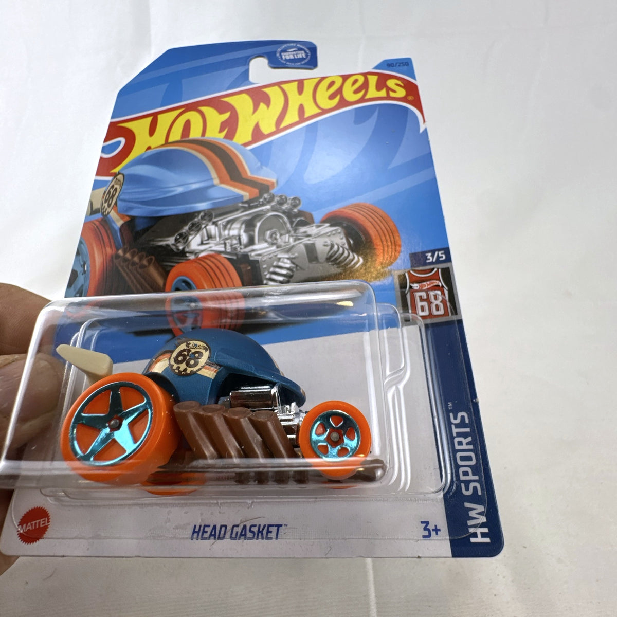 Hot Wheels Head Gasket diecast car in satin blue from the HW Sports series in original blister packaging