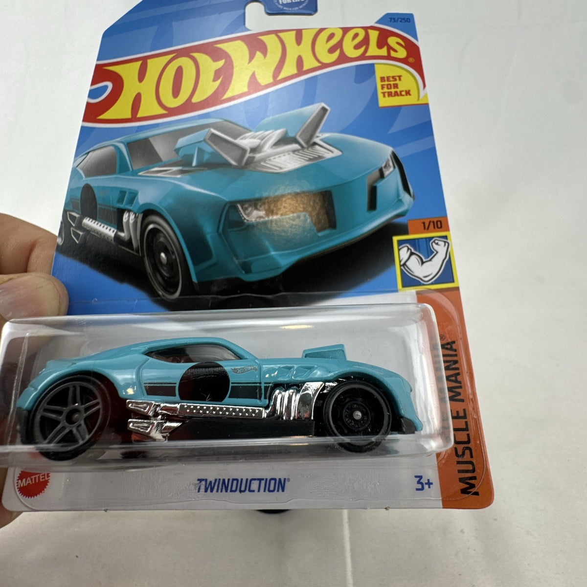 Hot Wheels Twinduction 1:64 scale diecast muscle car in light blue, factory sealed on original Muscle Mania card.