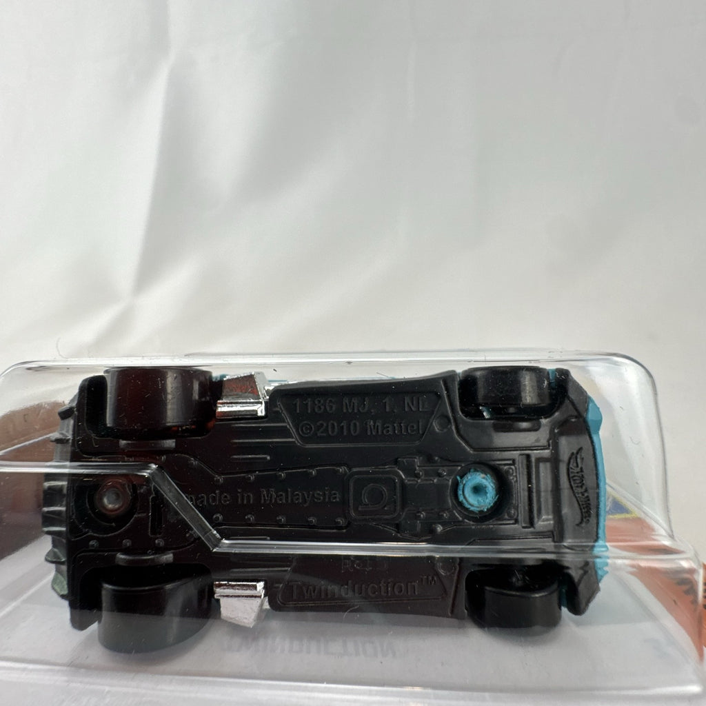 Hot Wheels Twinduction 1:64 scale diecast muscle car in light blue, factory sealed on original Muscle Mania card.