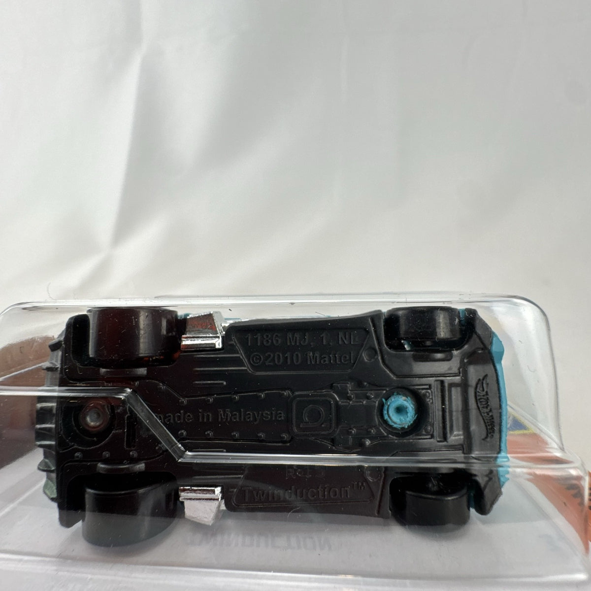 Hot Wheels Twinduction 1:64 scale diecast muscle car in light blue, factory sealed on original Muscle Mania card.