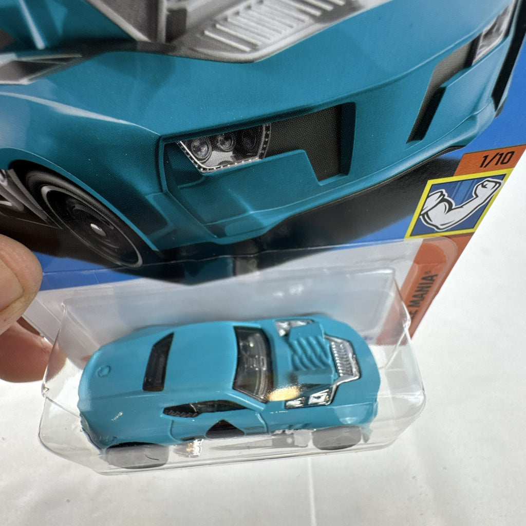 Hot Wheels Twinduction 1:64 scale diecast muscle car in light blue, factory sealed on original Muscle Mania card.