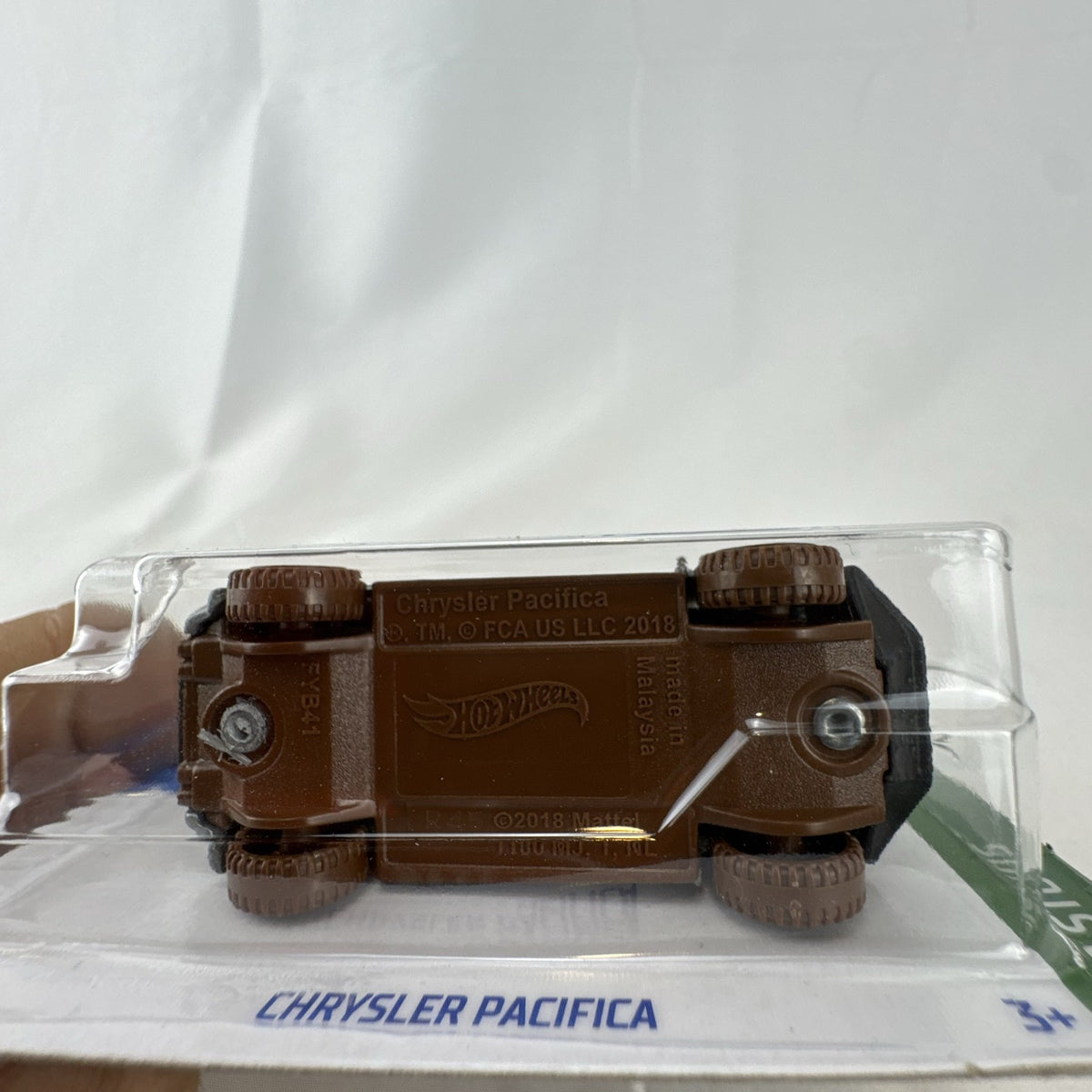 Hot Wheels Mud Studs Chrysler Pacifica off-road minivan 1:64 scale diecast model in original blister packaging