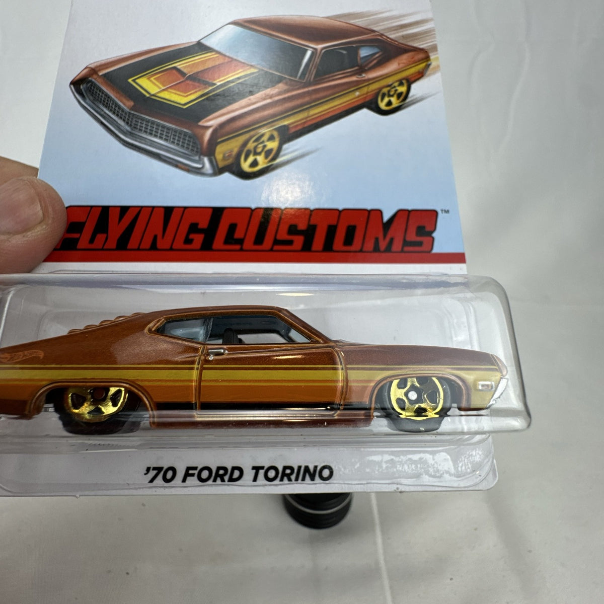 Hot Wheels 1970 Ford Torino Flying Customs 1:64 diecast car in metallic brown on original blister card