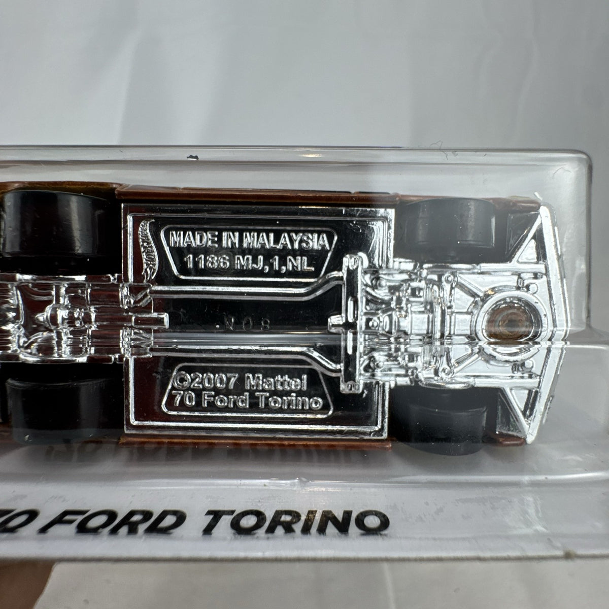 Hot Wheels 1970 Ford Torino Flying Customs 1:64 diecast car in metallic brown on original blister card