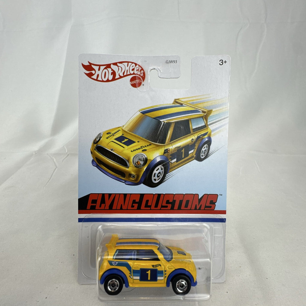Factory sealed Hot Wheels 1:64 MINI Cooper S Challenge Flying Customs diecast car in yellow with blue racing stripes.