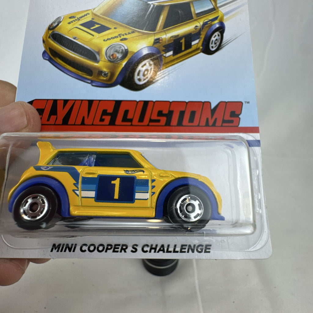 Factory sealed Hot Wheels 1:64 MINI Cooper S Challenge Flying Customs diecast car in yellow with blue racing stripes.
