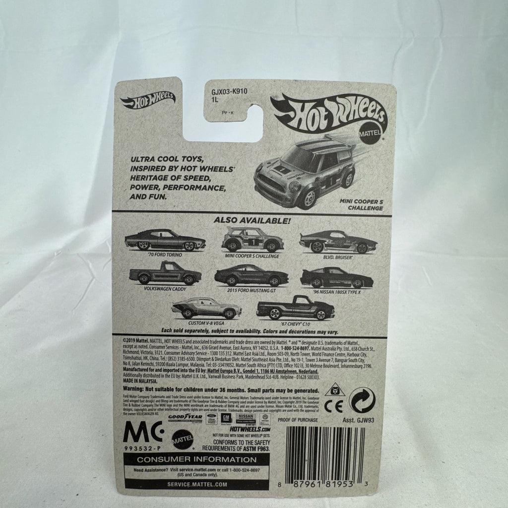 Factory sealed Hot Wheels 1:64 MINI Cooper S Challenge Flying Customs diecast car in yellow with blue racing stripes.