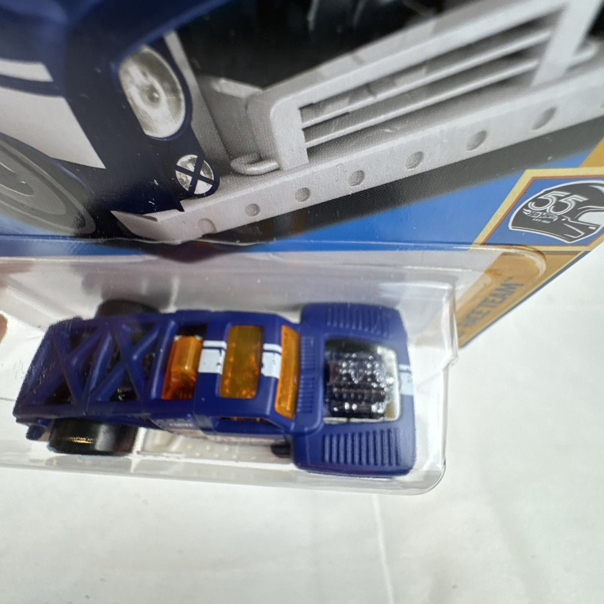Hot Wheels 1:64 scale Erikenstein Rod diecast pickup truck in dark blue 55th Anniversary packaging