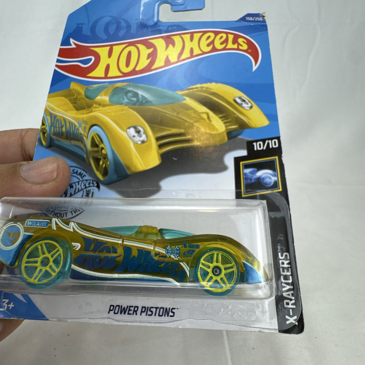 Sealed 2018 Hot Wheels Power Pistons X-Raycers translucent yellow 1:64 scale diecast car on original card