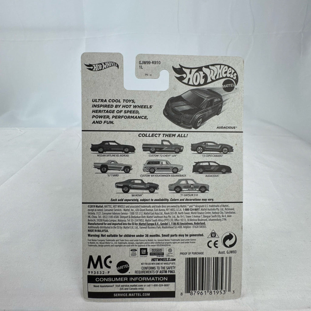 Factory sealed Hot Wheels Flying Customs Audacious 1:64 scale diecast tuner wagon in metallic purple with speed stripes.