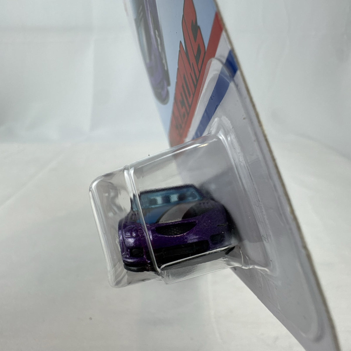 Factory sealed Hot Wheels Flying Customs Audacious 1:64 scale diecast tuner wagon in metallic purple with speed stripes.