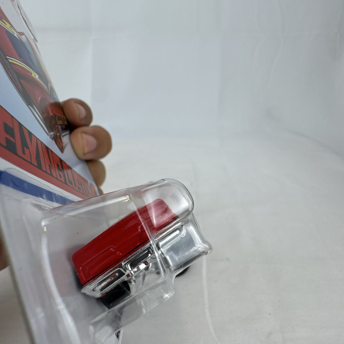 Hot Wheels Flying Customs Blvd. Bruiser 1:64 red diecast muscle car in sealed card packaging
