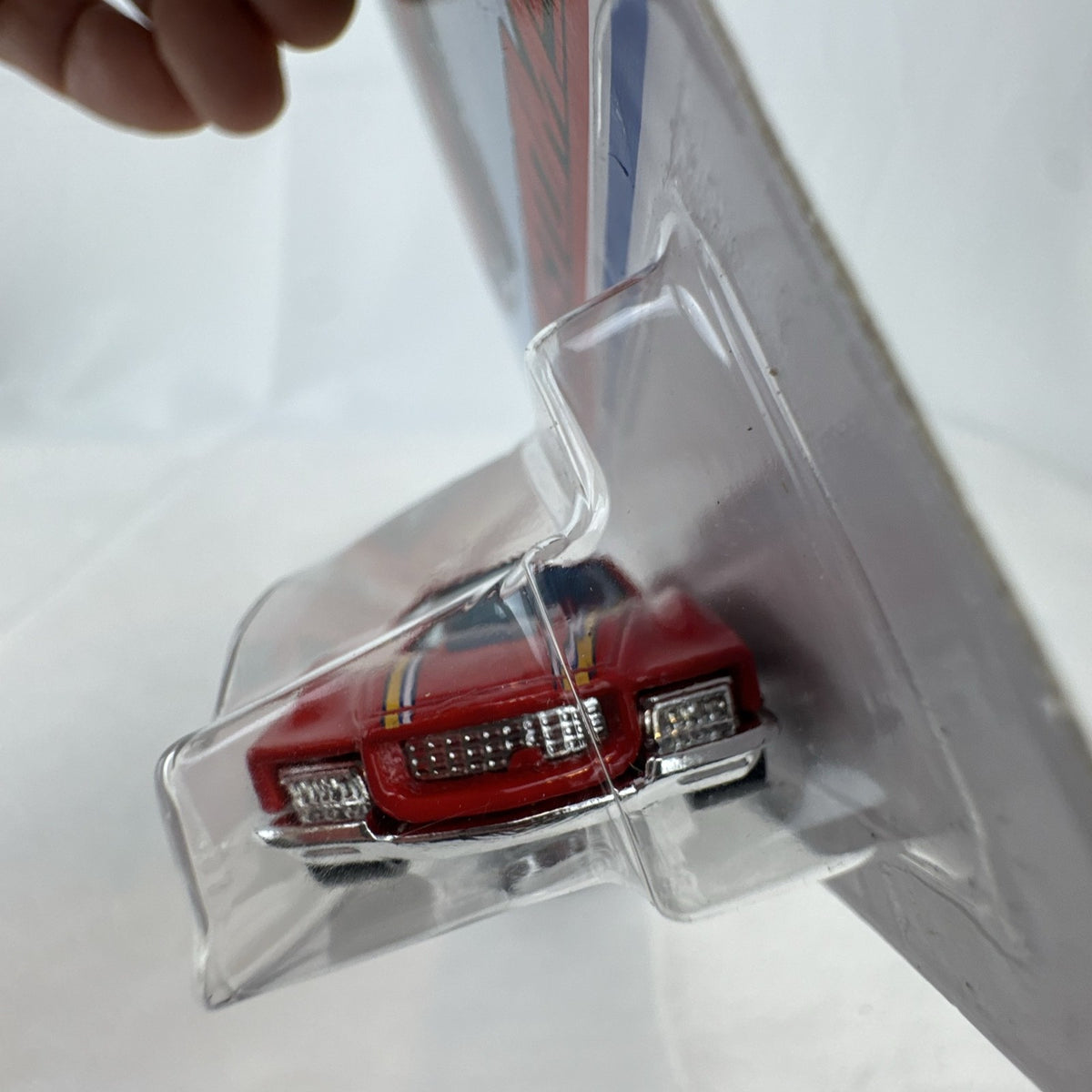 Hot Wheels Flying Customs Blvd. Bruiser 1:64 red diecast muscle car in sealed card packaging
