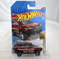 Hot Wheels 1:64 scale red Chrysler Pacifica off-road diecast van in original Baja Blazers blister card packaging.