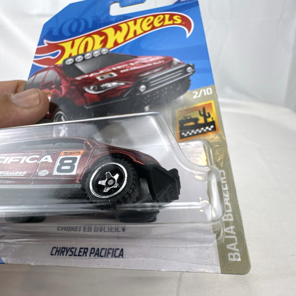 Hot Wheels 1:64 scale red Chrysler Pacifica off-road diecast van in original Baja Blazers blister card packaging.