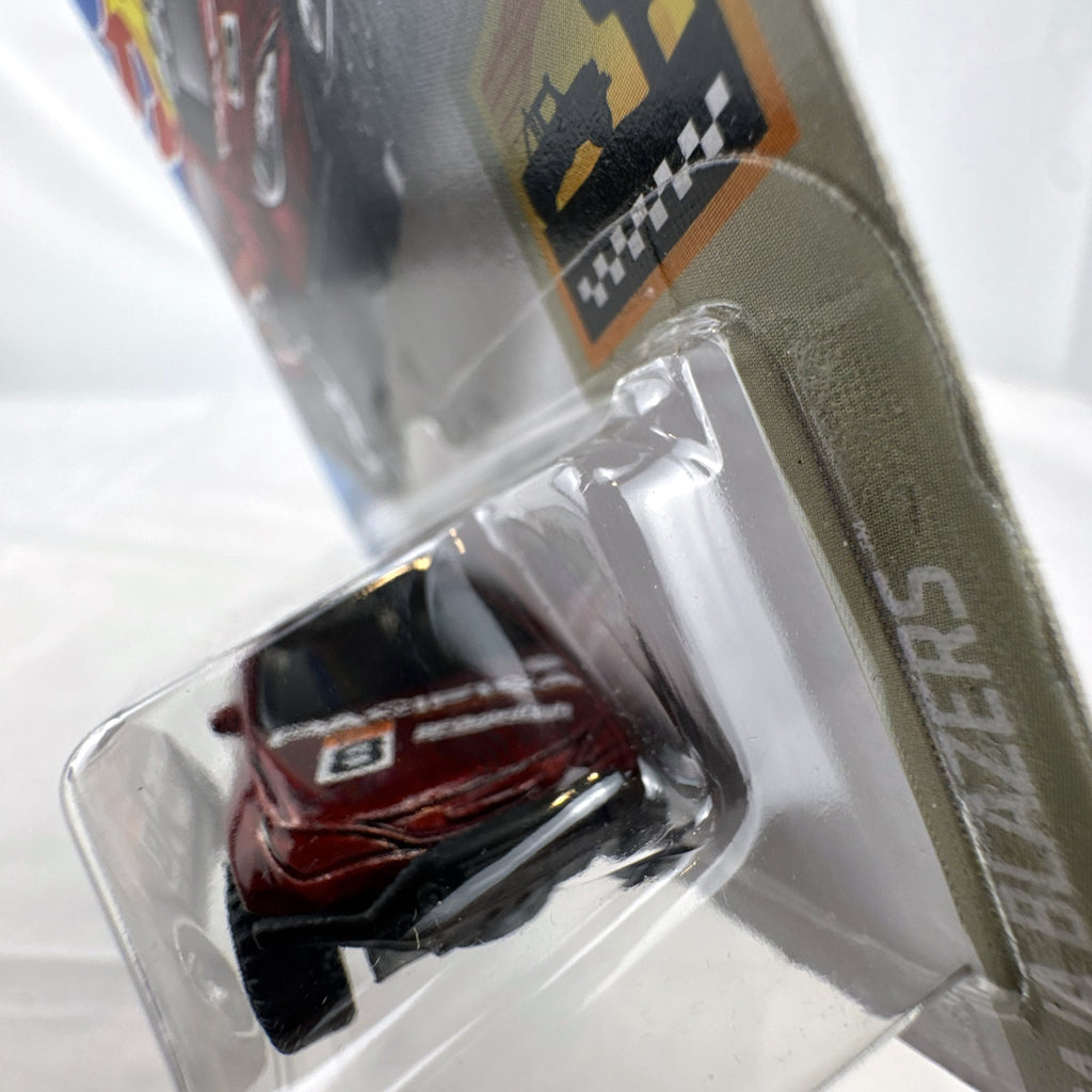 Hot Wheels 1:64 scale red Chrysler Pacifica off-road diecast van in original Baja Blazers blister card packaging.