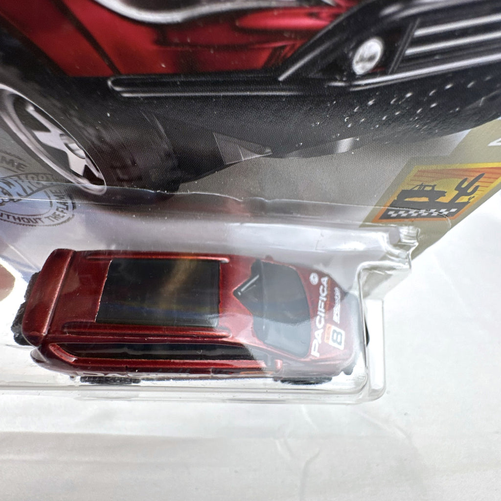 Hot Wheels 1:64 scale red Chrysler Pacifica off-road diecast van in original Baja Blazers blister card packaging.