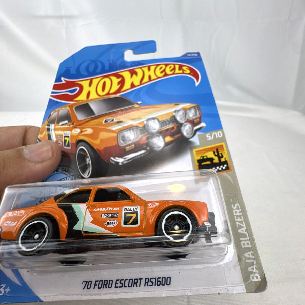 Hot Wheels 1:64 scale 1970 Ford Escort RS1600 diecast rally car in orange sealed on card
