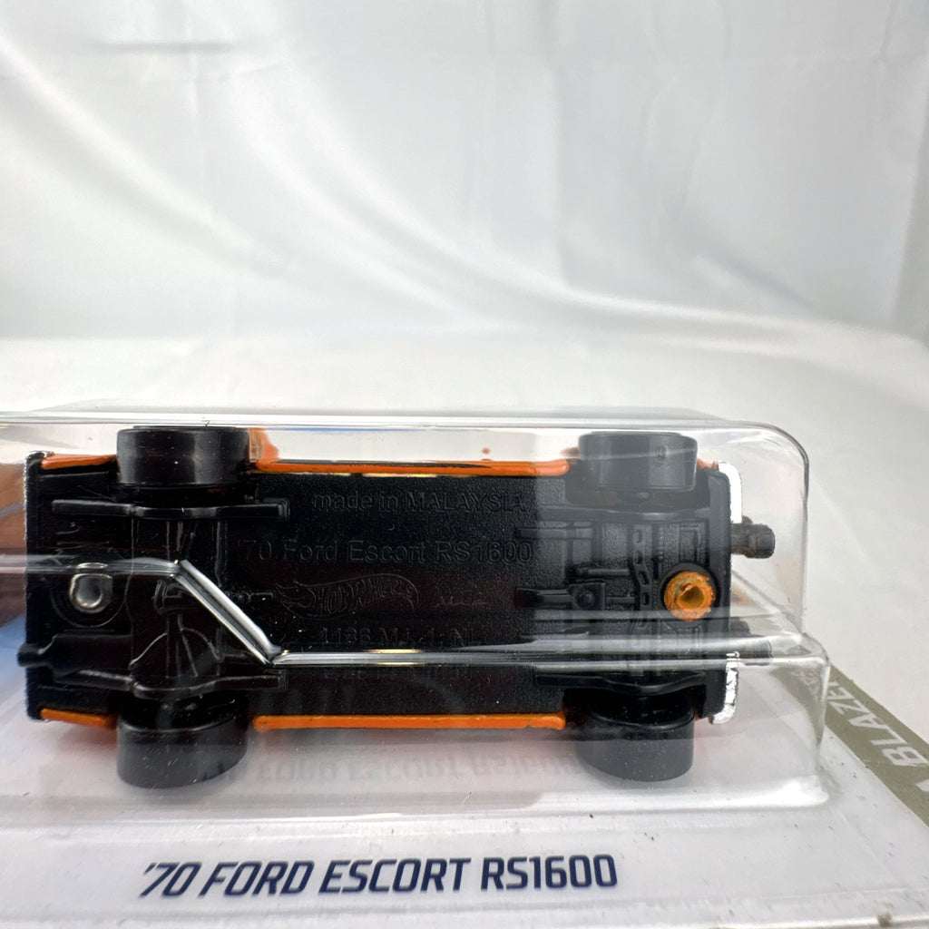 Hot Wheels 1:64 scale 1970 Ford Escort RS1600 diecast rally car in orange sealed on card