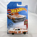 Hot Wheels 1:64 scale '57 Plymouth Fury diecast car in white with HW Flames graphics in original sealed packaging.