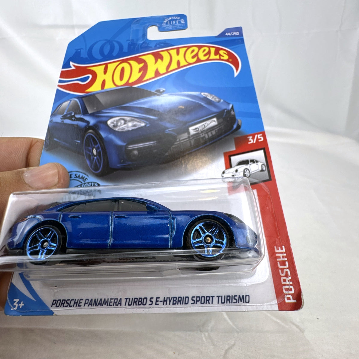 Hot Wheels 1:64 scale Porsche Panamera Turbo S E-Hybrid Sport Turismo in metallic blue diecast sealed on card