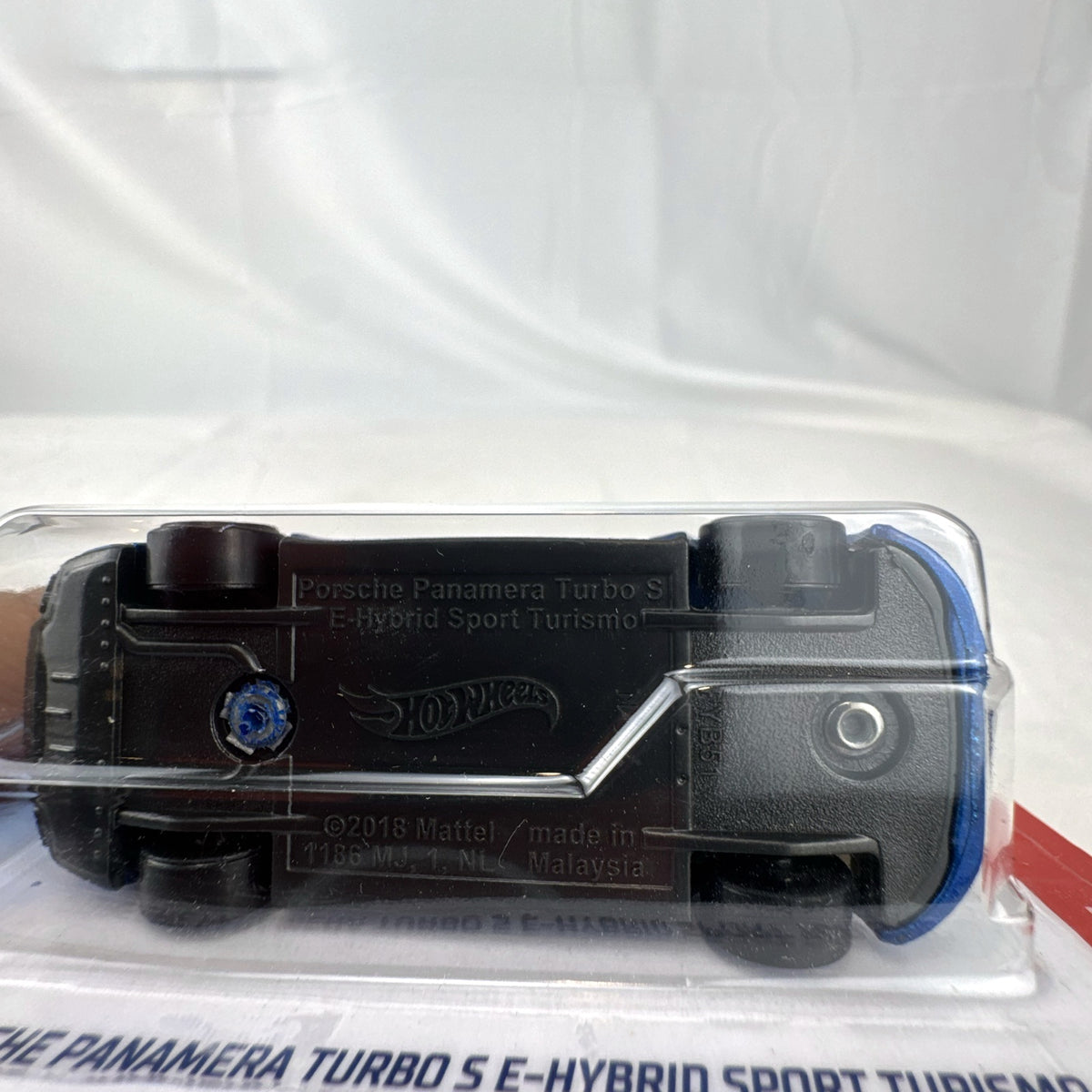 Hot Wheels 1:64 scale Porsche Panamera Turbo S E-Hybrid Sport Turismo in metallic blue diecast sealed on card