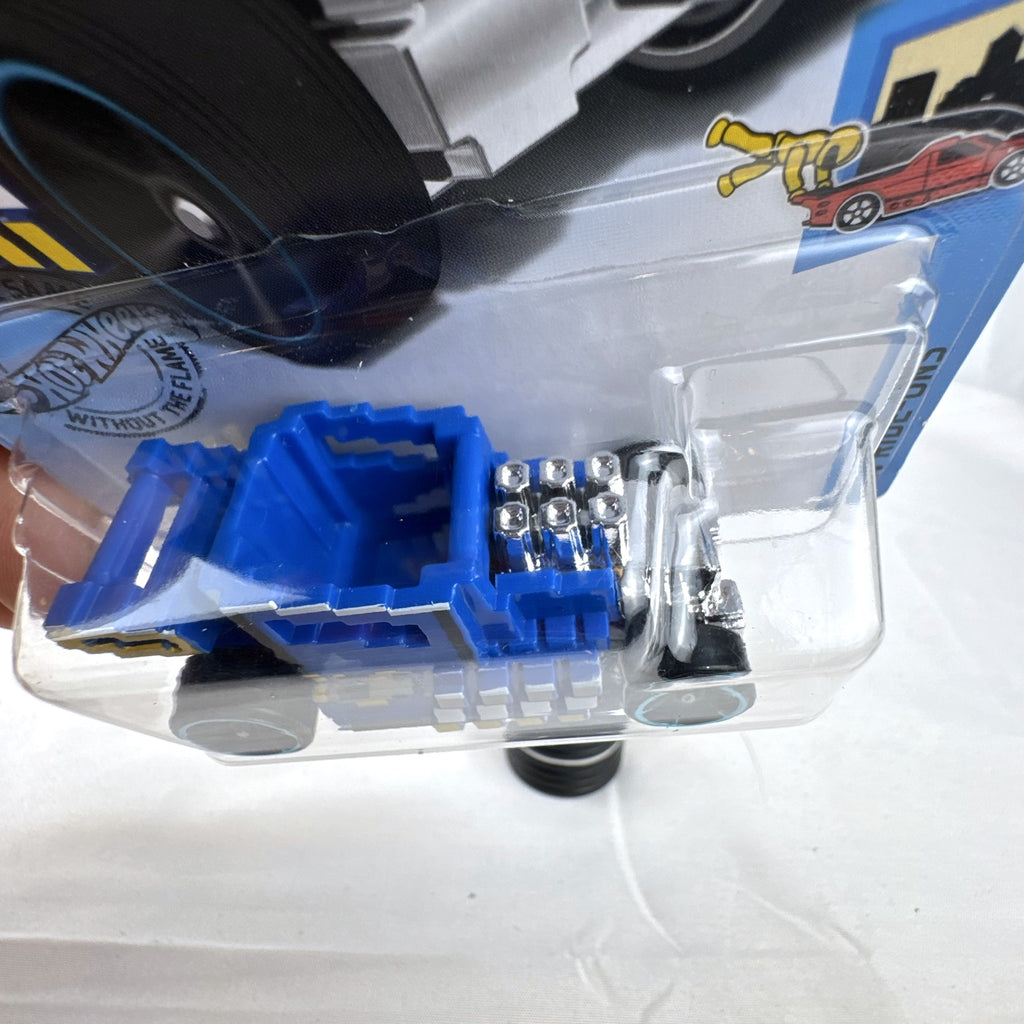 Hot Wheels Pixel Shaker 1:64 scale diecast car in blue with 8-bit graphics, factory sealed on original card.