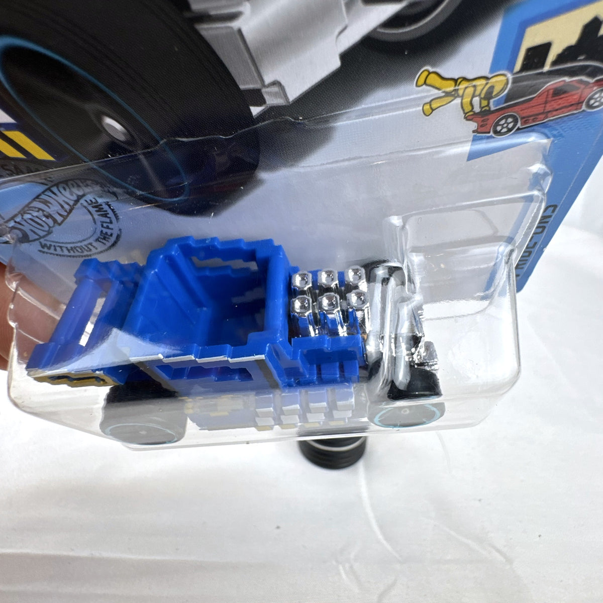 Hot Wheels Pixel Shaker 1:64 scale diecast car in blue with 8-bit graphics, factory sealed on original card.