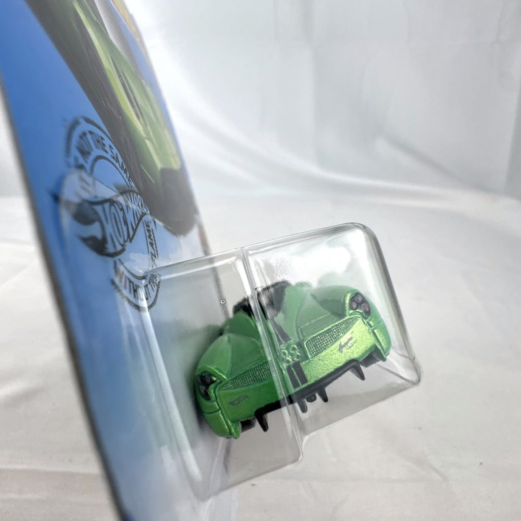 Hot Wheels 2017 Pagani Huayra Roadster 1:64 scale diecast car in metallic green packaged on original blister card.
