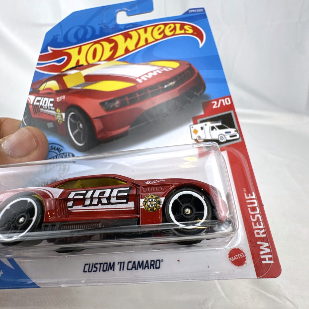 Hot Wheels Custom '11 Chevrolet Camaro HW Rescue diecast car in red, sealed on original backing card.