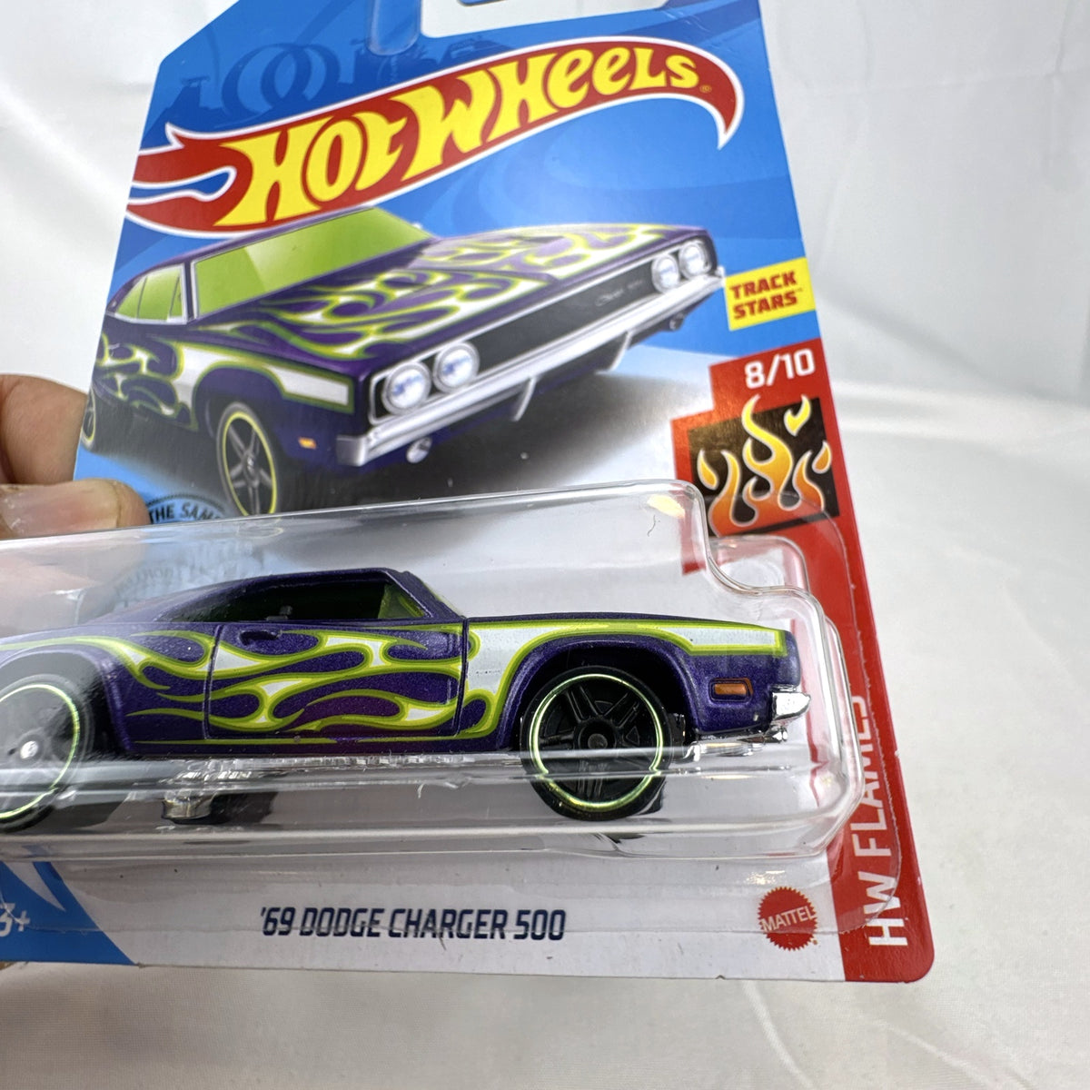 Hot Wheels 1:64 scale 1969 Dodge Charger 500 HW Flames diecast car in purple unopened packaging.