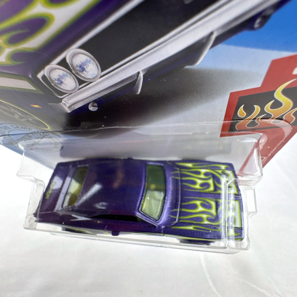 Hot Wheels 1:64 scale 1969 Dodge Charger 500 HW Flames diecast car in purple unopened packaging.