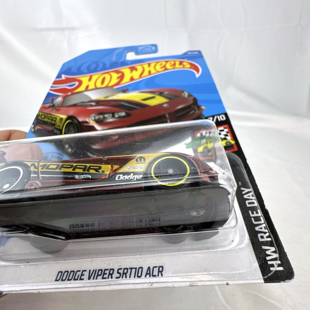 Hot Wheels 1:64 scale Dodge Viper SRT10 ACR diecast car in metallic red with Mopar race graphics, unopened packaging.