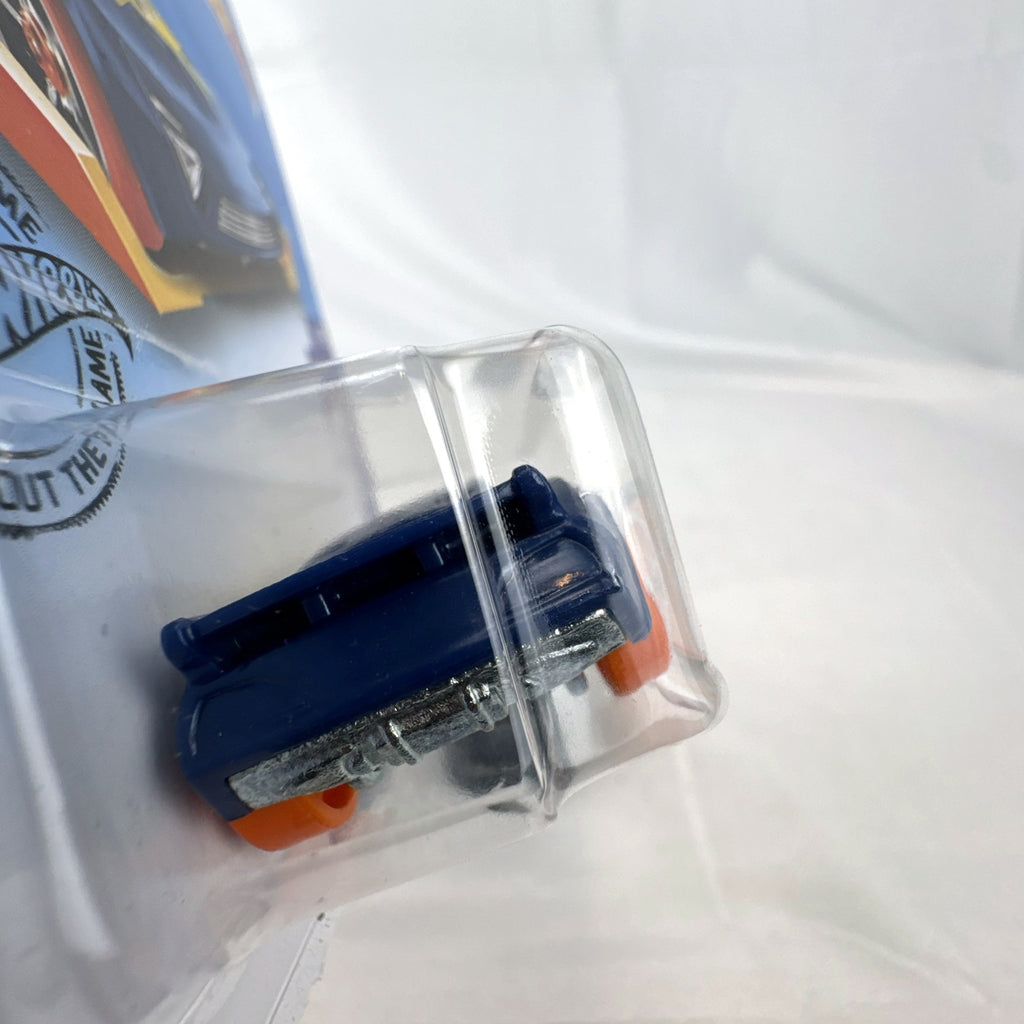 Hot Wheels 1:64 scale Nerve Hammer diecast car in deep blue with orange wheels, sealed on original card.
