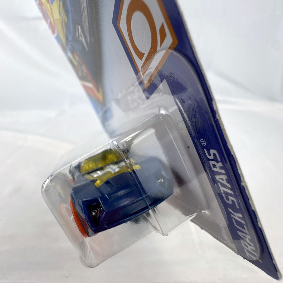 Hot Wheels 1:64 scale Nerve Hammer diecast car in deep blue with orange wheels, sealed on original card.