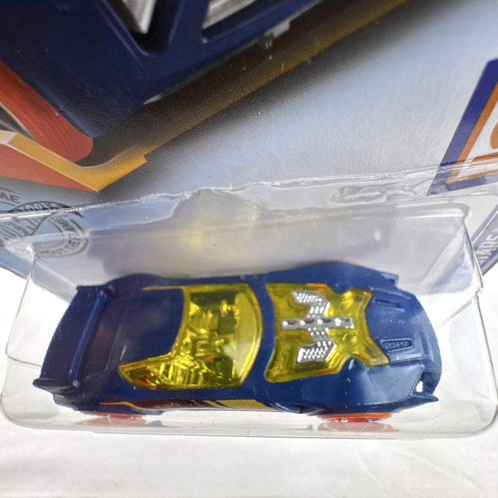 Hot Wheels 1:64 scale Nerve Hammer diecast car in deep blue with orange wheels, sealed on original card.