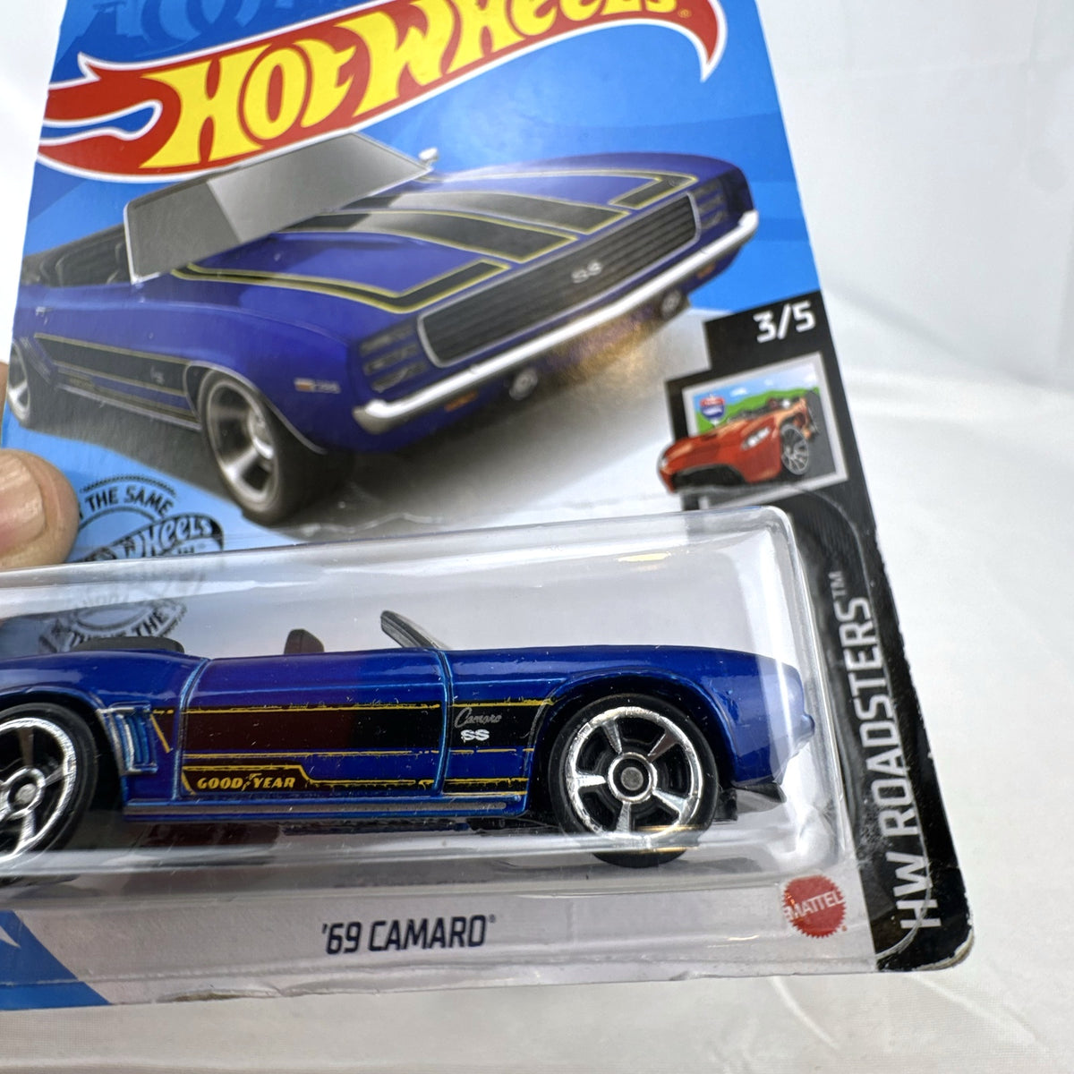 Hot Wheels 1:64 scale 1969 Chevrolet Camaro SS Convertible in deep blue with black and gold racing stripes on original card